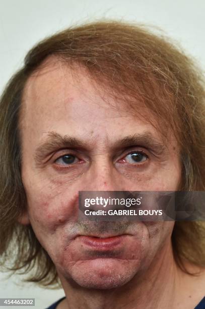 French writer Michel Houellebecq poses during the photocall of the movie "Near Death Experience" presented in the Orizzonti selection at the 71st...