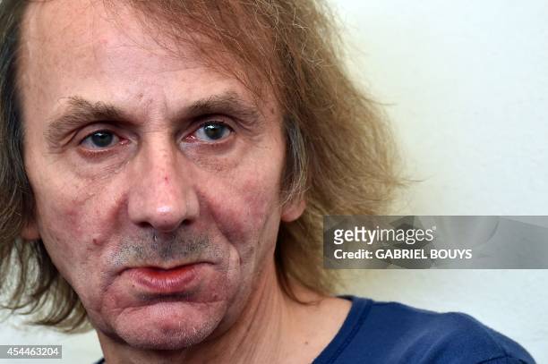 French writer Michel Houellebecq poses during the photocall of the movie "Near Death Experience" presented in the Orizzonti selection at the 71st...