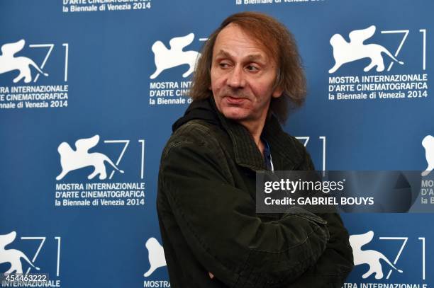 French writer Michel Houellebecq poses during the photocall of the movie "Near Death Experience" presented in the Orizzonti selection at the 71st...