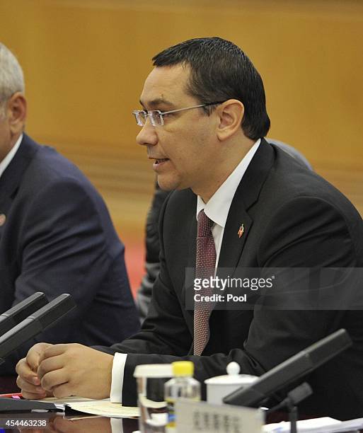 Romanian Prime Minister Victor Ponta talks with Chinese Premier Li Keqiang during a meeting at the Great Hall of the People on September 1, 2014 in...