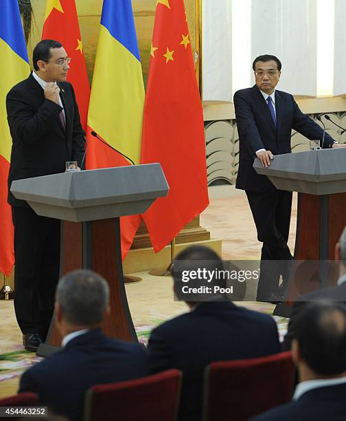 Romanian Prime Minister Victor Ponta talks during a joint press conference with Chinese Premier Li Keqiang at the Great Hall of the People on...