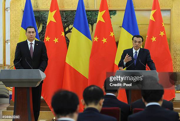 Chinese Premier Li Keqiang , talks during a joint press conference with Romanian Prime Minister Victor Ponta at the Great Hall of the People on...