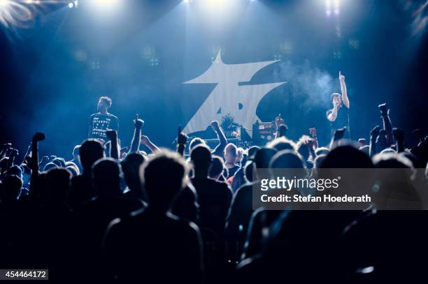 Singers Rowdy Superstar, Nic Endo and Alec Empire of German band Atari Teenage Riot perform live on stage during day 1 of the Greenville Festival on...