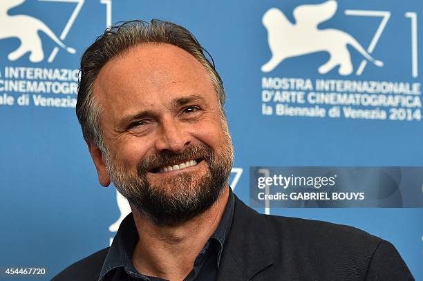 Italian actor Massimo Popolizio poses during the photocall of the movie "Il Giovane Favoloso" presented in competition at the 71st Venice Film...