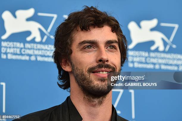 Italian actor Michele Riondino poses during the photocall of the movie "Il Giovane Favoloso" presented in competition at the 71st Venice Film...