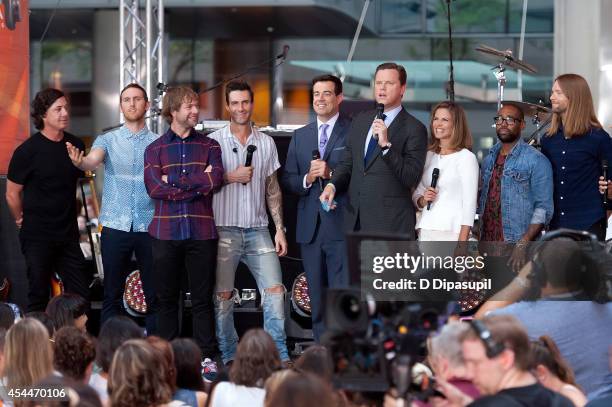 Carson Daly, Willie Geist, and Natalie Morales speak on stage with Matt Flynn, Jesse Carmichael, Mickey Madden, Adam Levine, PJ Morton, and James...