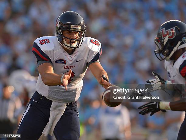 Josh Woodrum of the Liberty Flames against the North Carolina Tar Heels during their game at Kenan Stadium on August 30, 2014 in Chapel Hill, North...