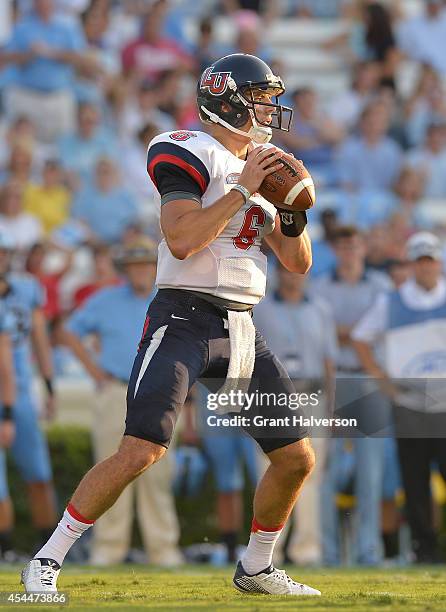 Josh Woodrum of the Liberty Flames against the North Carolina Tar Heels during their game at Kenan Stadium on August 30, 2014 in Chapel Hill, North...