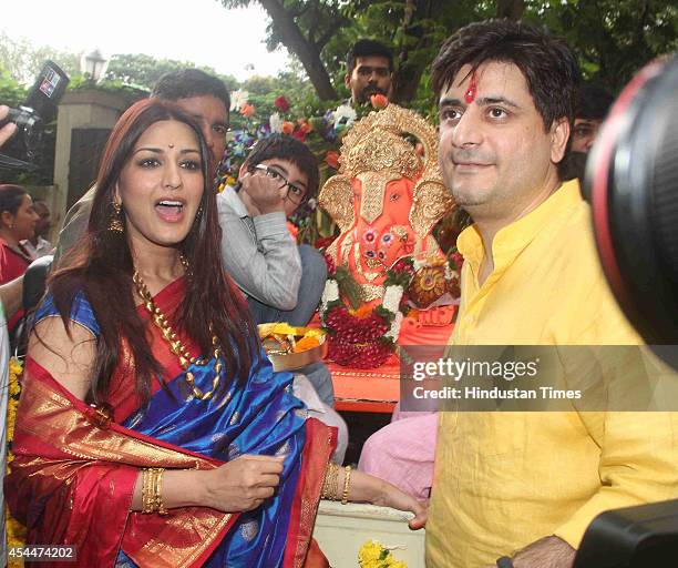 Bollywood actor Sonali Bendre with her husband Goldie Behl at their Ganesh Idol immersion procession on August 30, 2014 in Mumbai, India.
