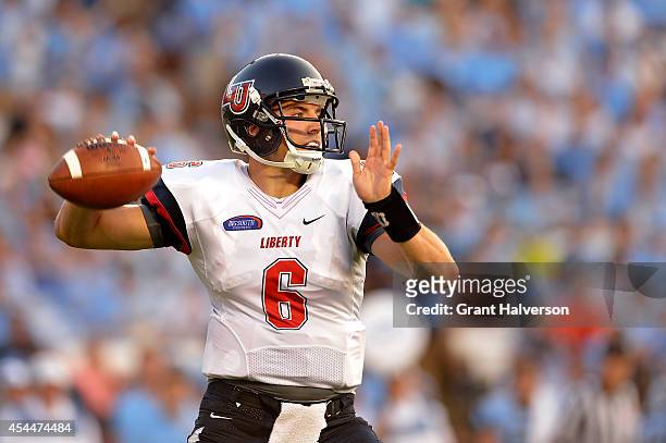 Josh Woodrum of the Liberty Flames against the North Carolina Tar Heels during their game at Kenan Stadium on August 30, 2014 in Chapel Hill, North...