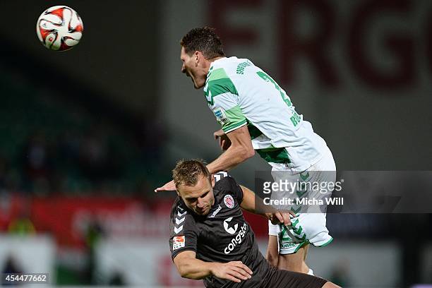 Bernd Nehrig of St.Pauli and Benedikt Roecker of Fuerth tussle for the ball during the Second Bundesliga match between Greuther Fuerth and FC St....