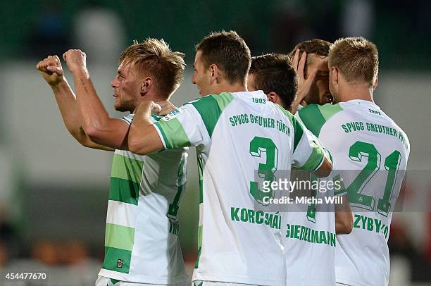 Florian Trinks of Fuerth celebrates with team-mates after scoring his team's third goal during the Second Bundesliga match between Greuther Fuerth...