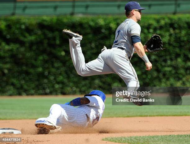 Scooter Gennett of the Milwaukee Brewers forces out Luis Valbuena of the Chicago Cubs during the fourth inning on September 1, 2014 at Wrigley Field...