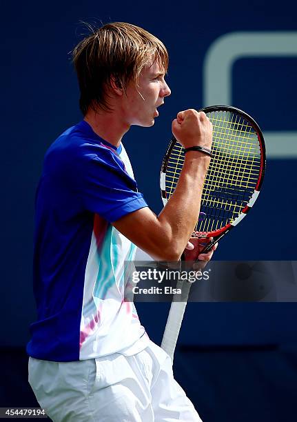 Alexander Bublik of Russia plays against Naoki Nakagawa of Japan in their junior boys' first round match on Day Eight of the 2014 US Open at the USTA...