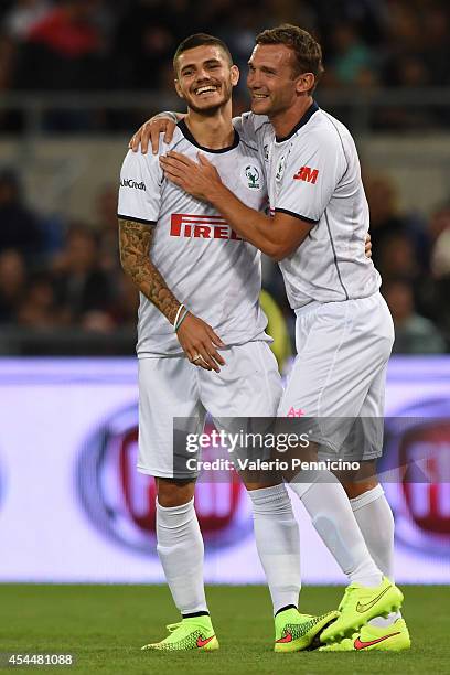 Mauri Icardi celebrates a goal with Andrey Shevchenko during the Interreligious Match For Peace at Olimpico Stadium on September 1, 2014 in Rome,...