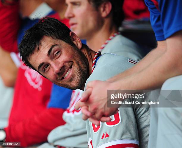Cole Hamels of the Philadelphia Phillies relaxes in the dugout during the eighth inning of a four pitcher no-hitter against the Atlanta Braves at...