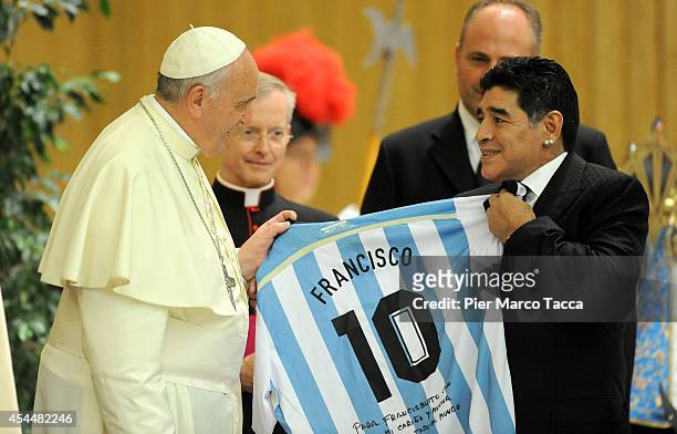 Pope Francis meets Diego Maradona during an audience with the players of the 'Partita Interreligiosa Della Pace' at Paul VI Hall before the...