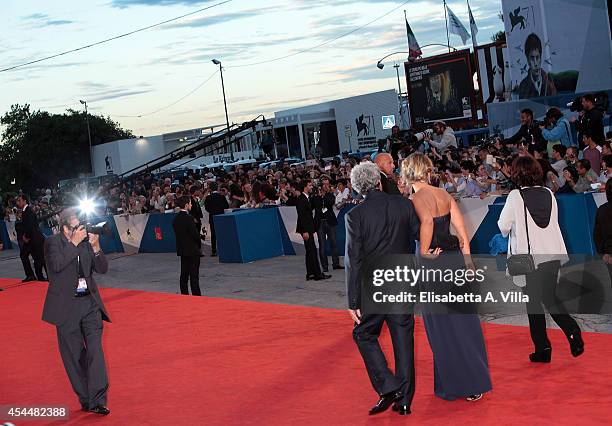 Director Mario Martone and wife Ippolita di Majo attend the 'Il Giovane Favoloso' premiere during the 71st Venice Film Festival at Sala Grande on...