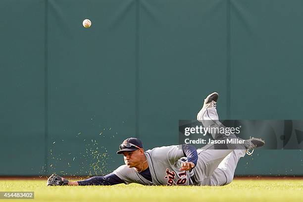 Center fielder Ezequiel Carrera of the Detroit Tigers misses on a diving catch hit by Zach Walters of the Cleveland Indians during the sixth inning a...