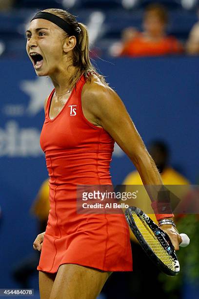 Aleksandra Krunic of Serbia reacts after winning the first set against Victoria Azarenka of Belarus during their women's singles fourth round match...