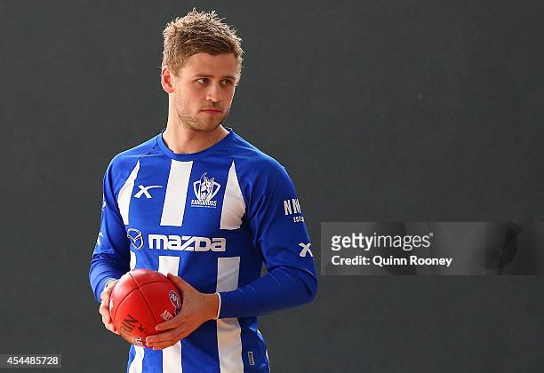Kieran Harper of the Kangaroos looks on during a North Melbourne Kangaroos AFL media session at Arden Street Ground on September 2, 2014 in...