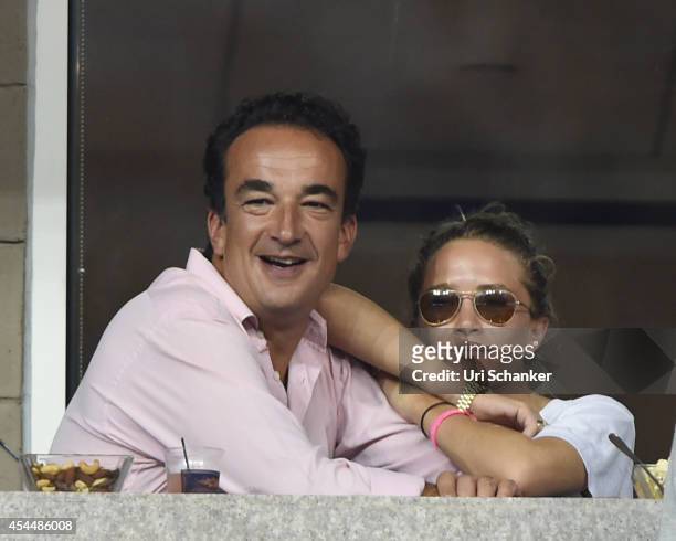 Olivier Sarkozy and Mary Kate Olsen attend day 8 of the 2014 US Open at USTA Billie Jean King National Tennis Center on September 1, 2014 in New York...