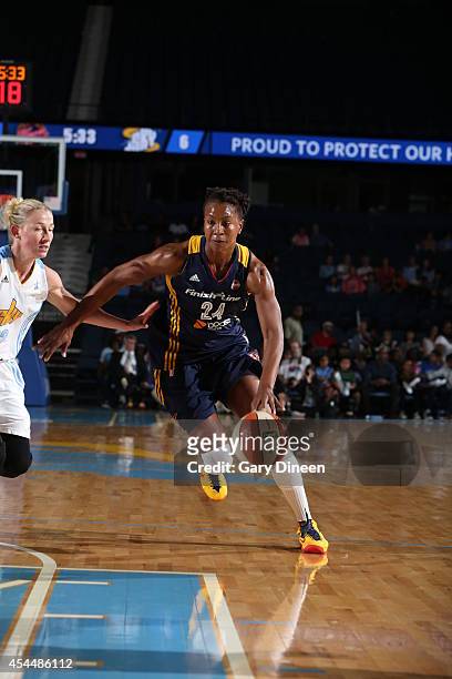Tamika Catchings of the Indiana Fever drives to the basket against the Chicago Sky during game two of the WNBA Eastern Conference Finals as part of...