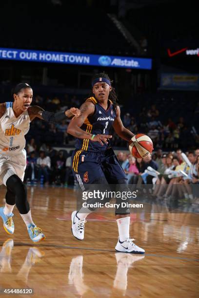 Shavonte Zellous of the Indiana Fever handles the ball against Tamera Young of the Chicago Sky during game two of the WNBA Eastern Conference Finals...
