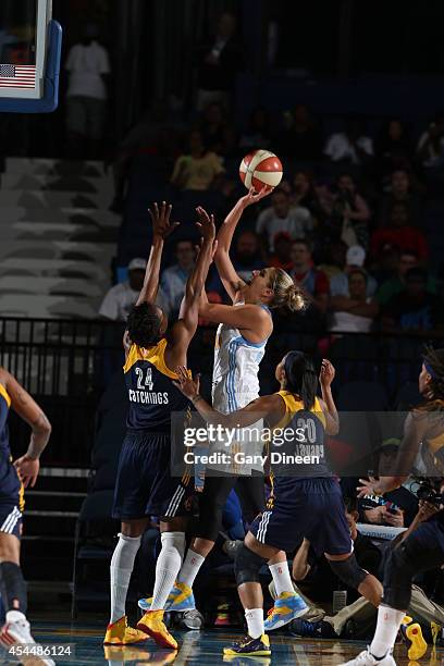 Elena Delle Donne of the Chicago Sky shoots the ball against Tamika Catchings and Briann January of the Indiana Fever during game two of the WNBA...
