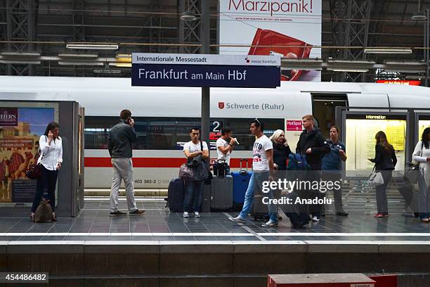 Passengers wait at Frankfurt am Main Central Station after German rail workers' labour union GDL called a nationwide three-hour strike on September...