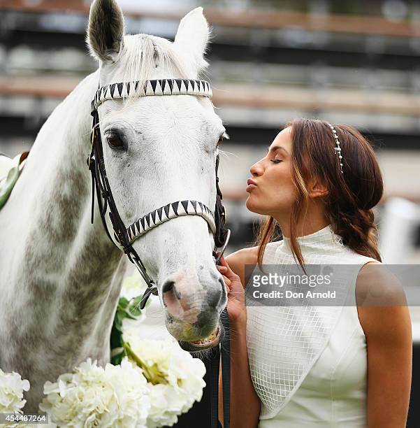 Rachael Finch poses alongside a horse at the launch the 2014 Sydney Spring Carnival at Royal Randwick Racecourse on September 2, 2014 in Sydney,...