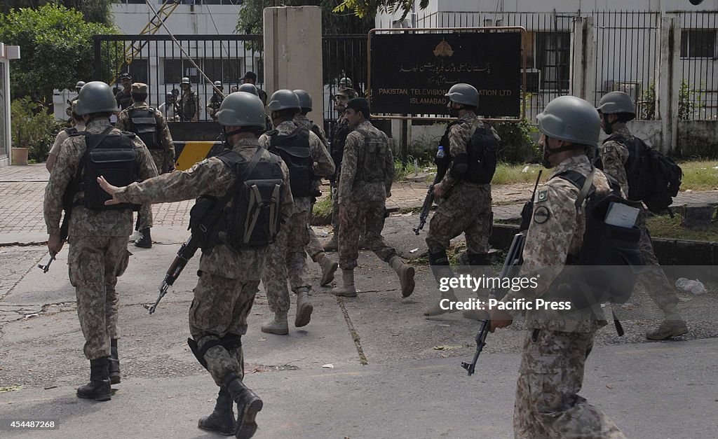 Pakistani  soldiers arrive at the Pakistan Television...