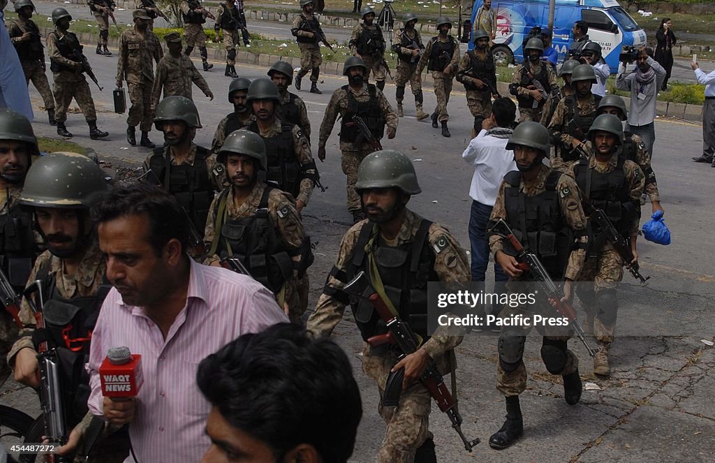 Pakistani soldiers arrive at the Pakistan Television...