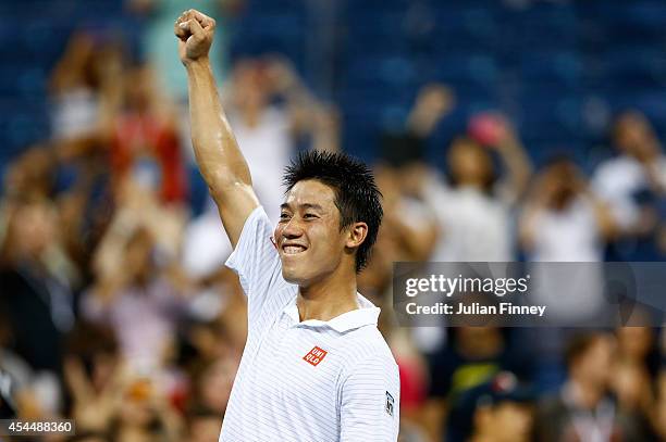 Kei Nishikori of Japan celebrates defeating Milos Raonic of Canada on Day Eight of the 2014 US Open at the USTA Billie Jean King National Tennis...