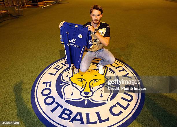 New signing Nick Powell of Leicester City FC poses with his shirt on a season long loan from Manchester United on September 1, 2014 in Leicester,...