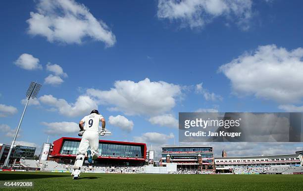 Adam Lyth of Yorkshire makes his way out to bat during the LV County Championship match between Lancashire and Yorkshire at Old Trafford on September...