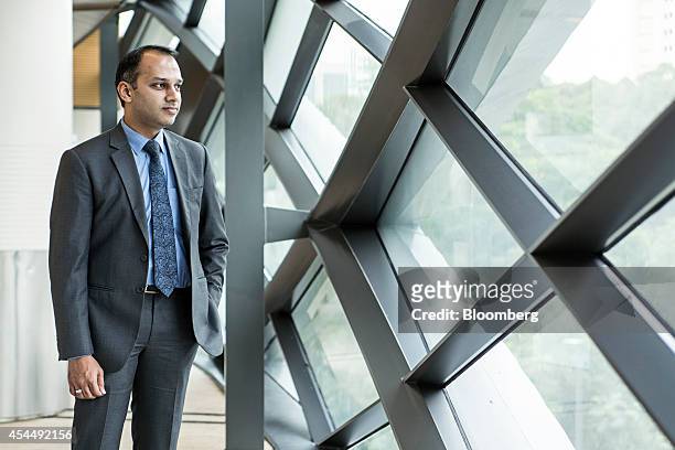 Faraz Uddin Amjad, joint director for insurance at the Securities and Exchange Commission of Pakistan, stands for a photograph after an interview at...