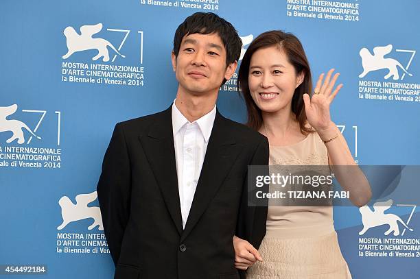 Japanese actor Ryo Kase and South Korean actress Moon So-ri pose during the photocall of the movie "Jayueui Onduk" presented in the Orizzonti...