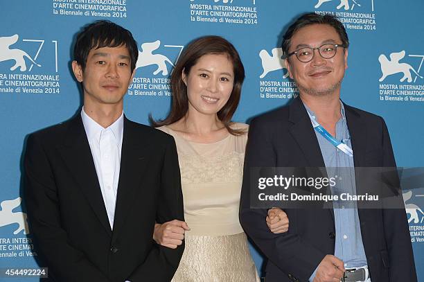 Actor Ryo Kase, actress Moon Sori and and actor Kim Euisung attend the 'Hill Of Freedom' photocall during the 71st Venice Film Festival on September...