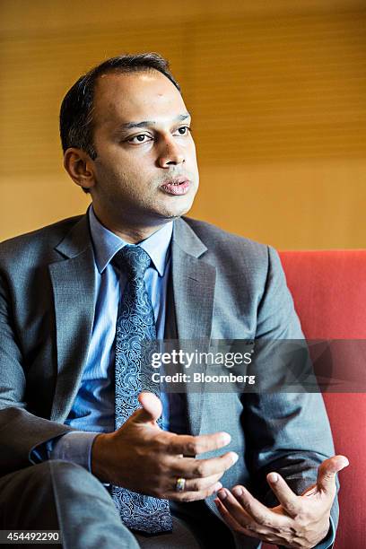 Faraz Uddin Amjad, joint director for insurance at the Securities and Exchange Commission of Pakistan, gestures as he speaks during an interview...