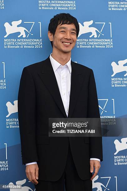Japanese actor Ryo Kase poses during the photocall of the movie "Jayueui Onduk" presented in the Orizzonti selection at the 71st Venice Film Festival...