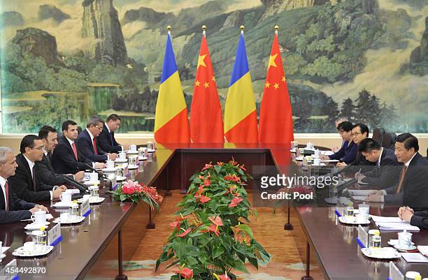 Chinese President Xi Jinping attends a meeting with Romanian Prime Minister Victor Ponta at the Great Hall of the People on September 1, 2014 in...