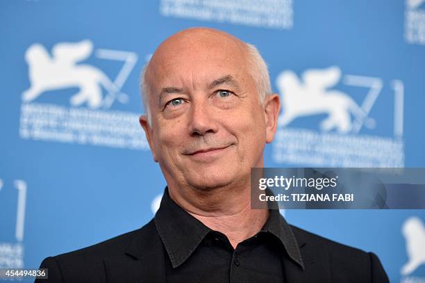 Italian director Davide Ferrario poses during the photocall of the movie "La Zuppa del Demonio" presented out of competition at the 71st Venice Film...