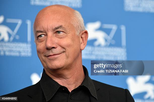 Italian director Davide Ferrario poses during the photocall of the movie "La Zuppa del Demonio" presented out of competition at the 71st Venice Film...