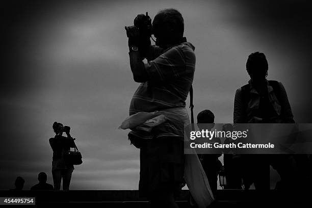 Tourists take pictures on a bridge in Venice during the 71st Venice Film Festival on September 1, 2014 in Venice, Italy.