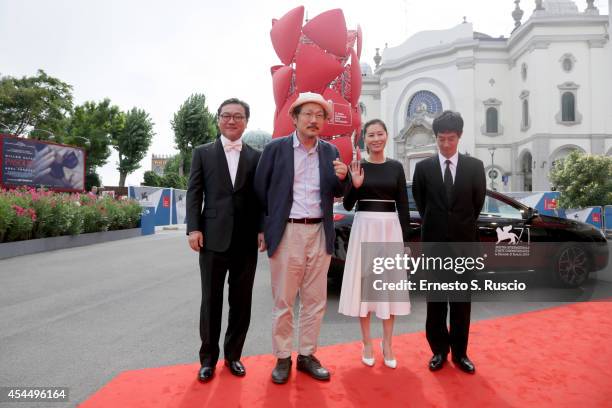Actor Kim Euisung, director Hong Sangsoo, actors Moon Sori and Ryo Kase attend the 'Hill Of Freedom' - Premiere during the 71st Venice Film Festival...