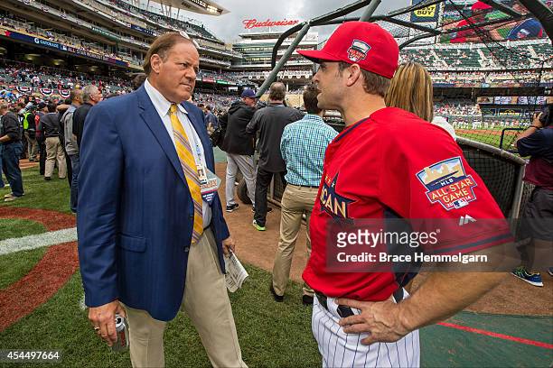 Brian Dozier of the Minnesota Twins talks with ESPN anchor Chris Berman during the Gatorade All-Star Workout Day at Target Field on July 14, 2014 in...