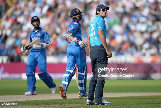 England captain Alastair Cook looks up to the stands after Ajinkya Rahane of India hits James Anderson for six runs during the 4th Royal London One...