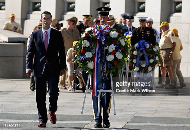 George Prescott Bush , grandson of President George H.W. Bush, participtes in wreath laying during a ceremony at the World War II Memorial, September...