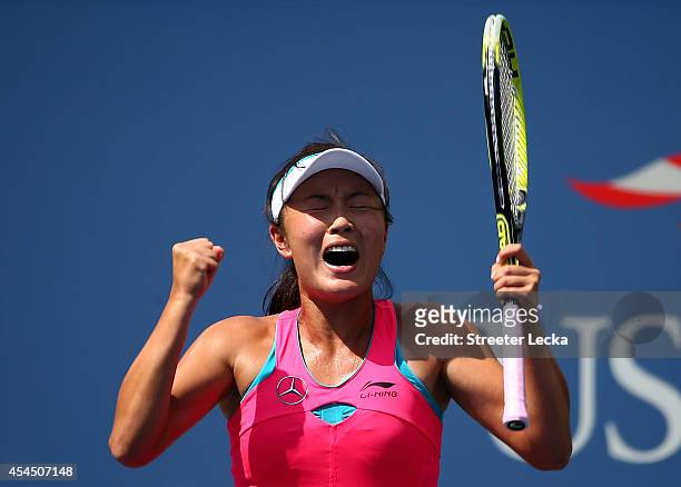 Shuai Peng of China celebrates after defeating Belinda Bencic of Switzerland in their women's singles quarterfinal match on Day Nine of the 2014 US...